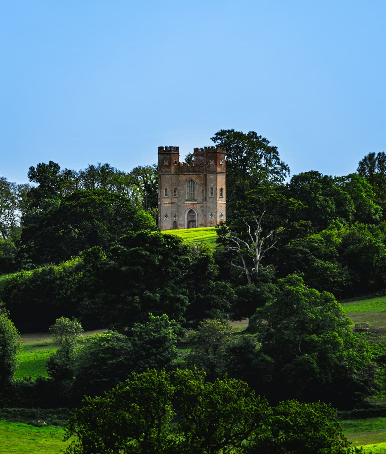 A stone castle tower against a dramatic sky, evoking the prison tower where Segismundo is chained in La vida es sueno